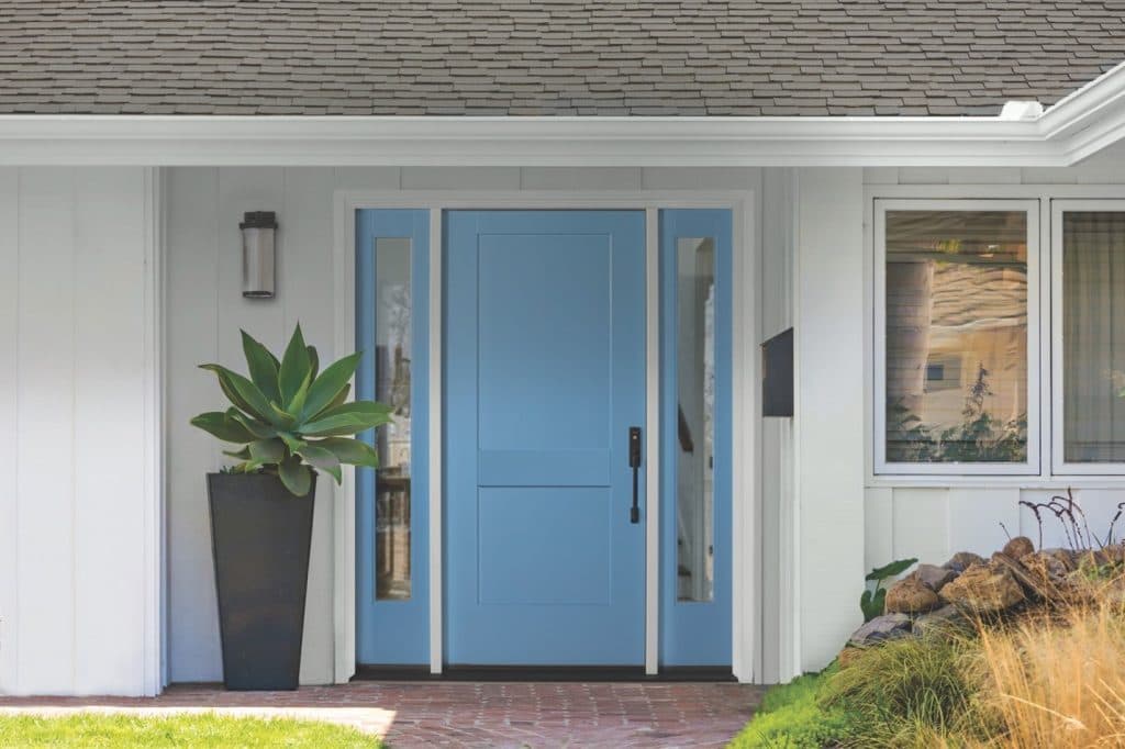 A light blue energy efficient exterior door flanked by sidelites on a white house 1024x682 1